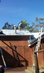 Jai Spraying Roof using harness safety system